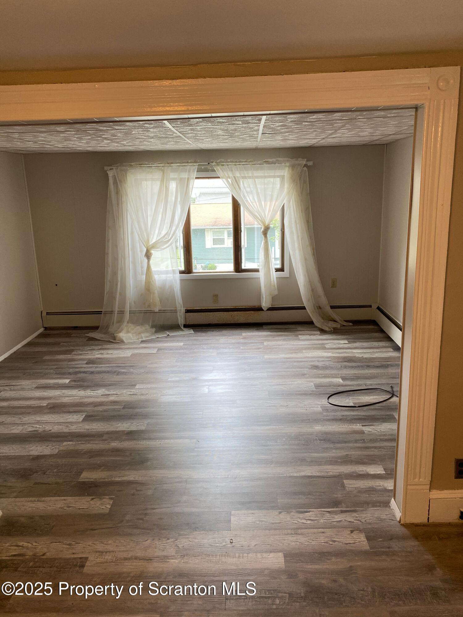 2133-2135 Jackson Street Scranton, PA 18504 - Photo 27 of 38 a view of room with wooden floor and a window