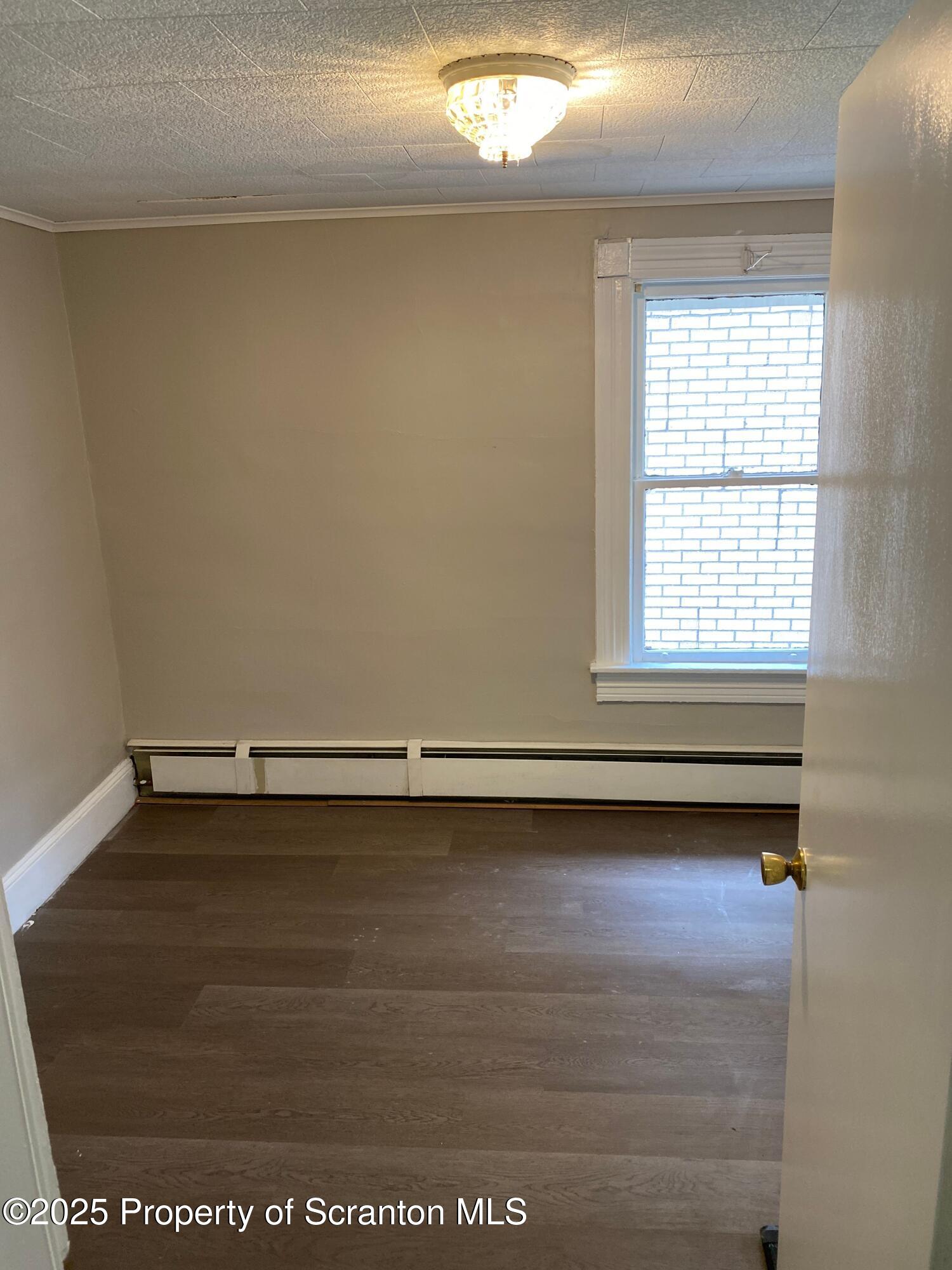 2133-2135 Jackson Street Scranton, PA 18504 - Photo 31 of 38 a view of a room with an empty space and window