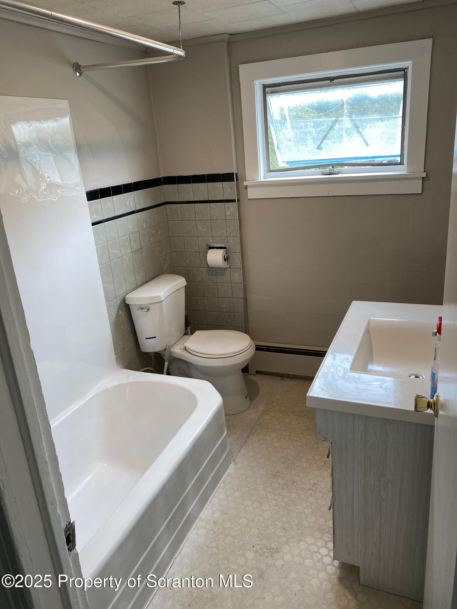 2133-2135 Jackson Street Scranton, PA 18504 - Photo 33 of 38 a bathroom with a toilet and a sink
