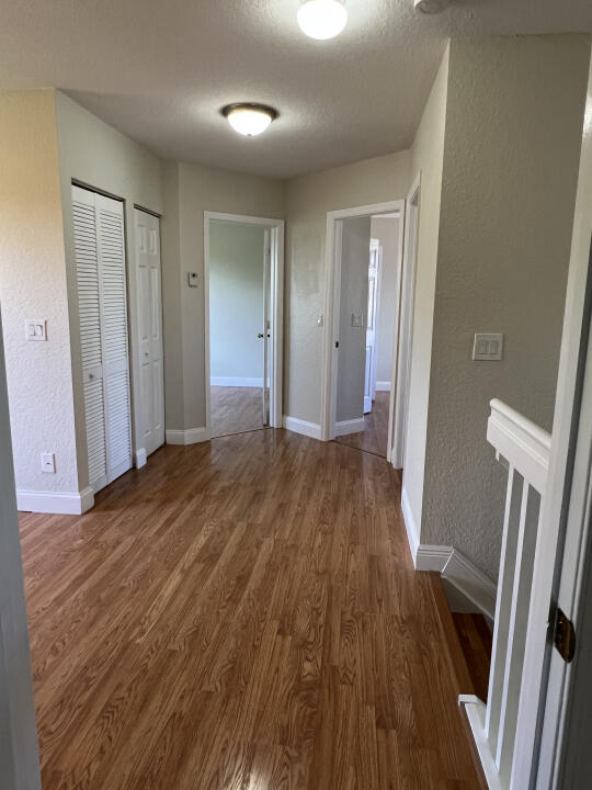 6610 Windmill Way Greenacres, FL 33413 - Photo 15 of 40 a view of a hallway with wooden floor and staircase