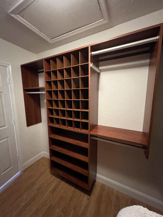 6610 Windmill Way Greenacres, FL 33413 - Photo 27 of 40 a view of walk in closet with empty racks