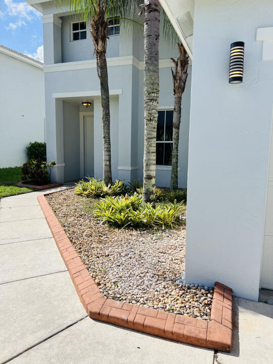 6610 Windmill Way Greenacres, FL 33413 - Photo 3 of 40 a front view of a house