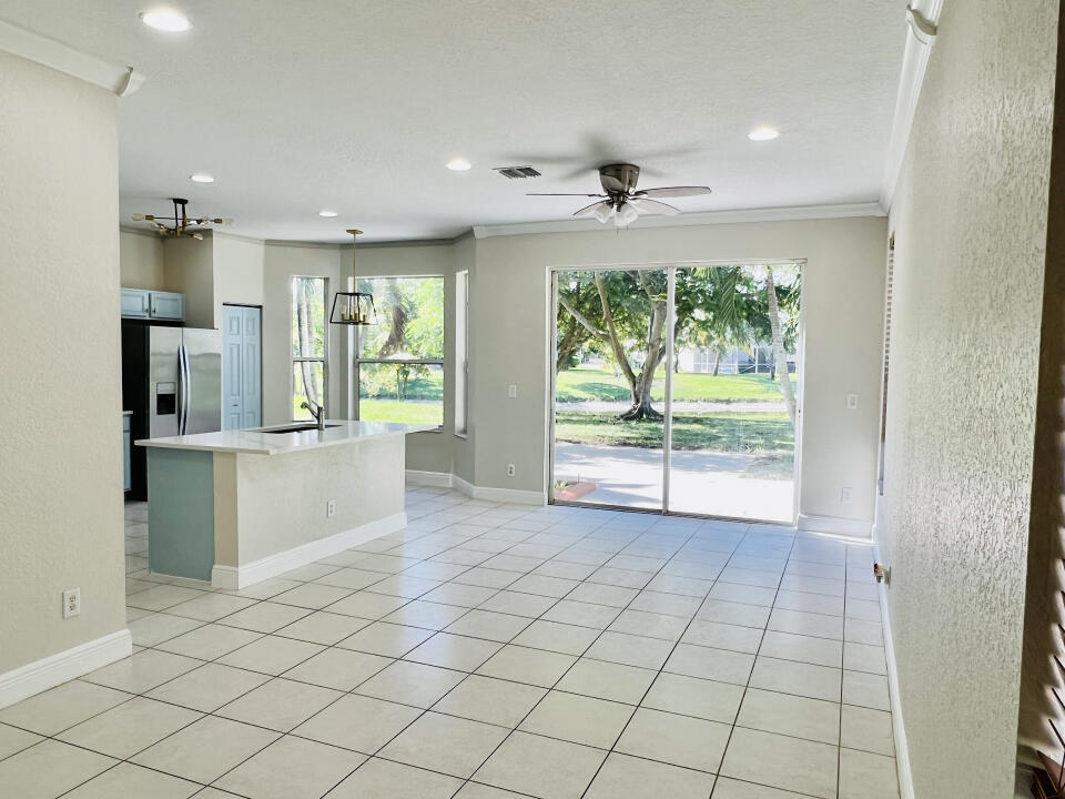 6610 Windmill Way Greenacres, FL 33413 - Photo 31 of 40 a view of an empty room with a window