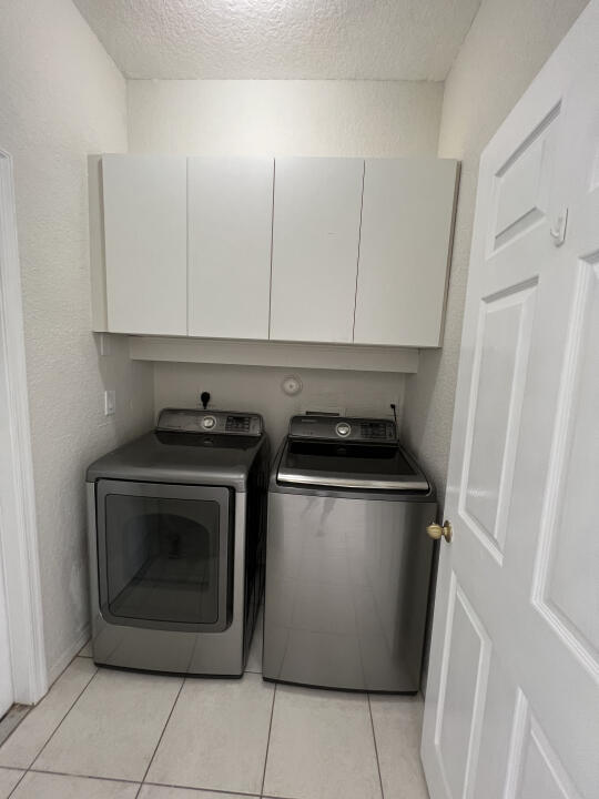 6610 Windmill Way Greenacres, FL 33413 - Photo 32 of 40 a utility room with washer and dryer
