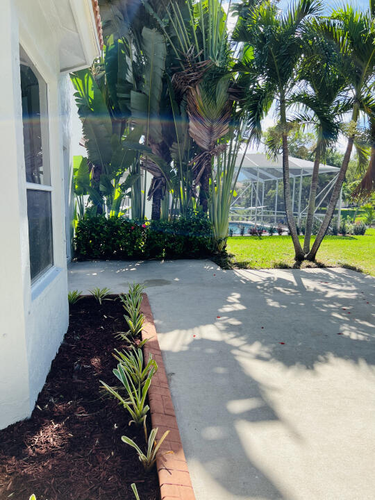 6610 Windmill Way Greenacres, FL 33413 - Photo 33 of 40 a view of a backyard with large tree