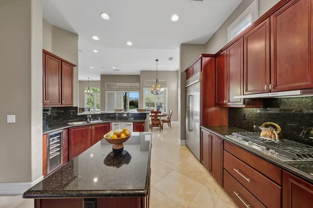 a view of a dining room with furniture and window