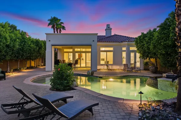 a view of a swimming pool with a patio