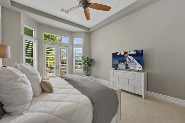 a spacious bathroom with a granite countertop tub sink shower and mirror