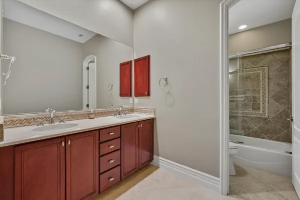 a kitchen with stainless steel appliances granite countertop a refrigerator sink and cabinets