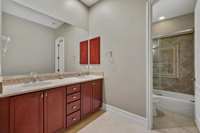 a kitchen with stainless steel appliances granite countertop a refrigerator sink and cabinets