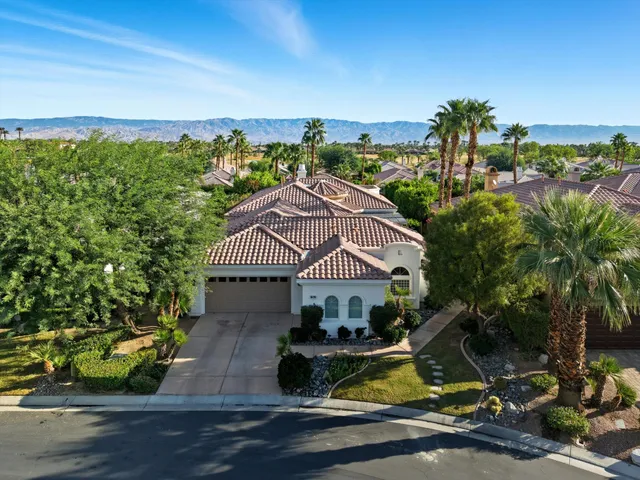 an aerial view of a house with a garden