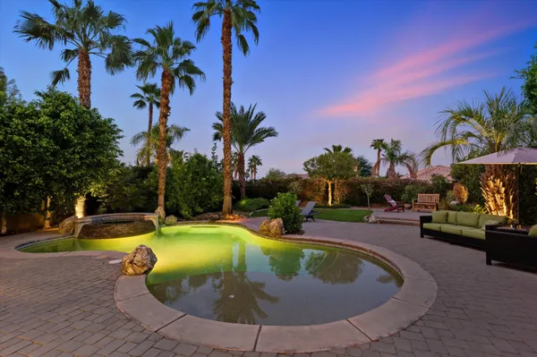 a view of a swimming pool with a sitting space