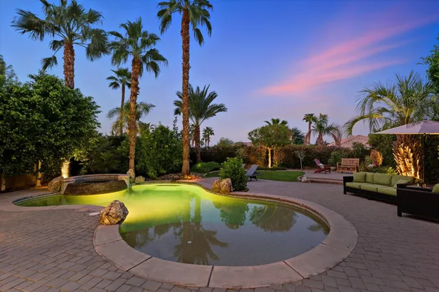 a view of a swimming pool with a sitting space