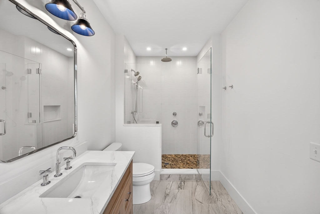 132 Great Western Road Harwich, MA 02645 - Photo 26 of 42 a bathroom with a sink toilet a shower and a mirror