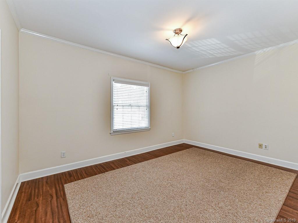 5925 Quail Hollow Road, Unit G Charlotte, NC 28210 - Photo 16 of 19 an empty room with a window