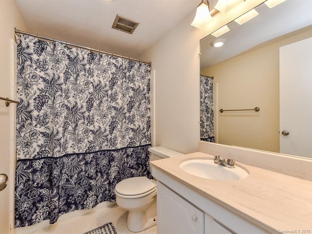 5925 Quail Hollow Road, Unit G Charlotte, NC 28210 - Photo 18 of 19 a bathroom with a sink toilet and shower