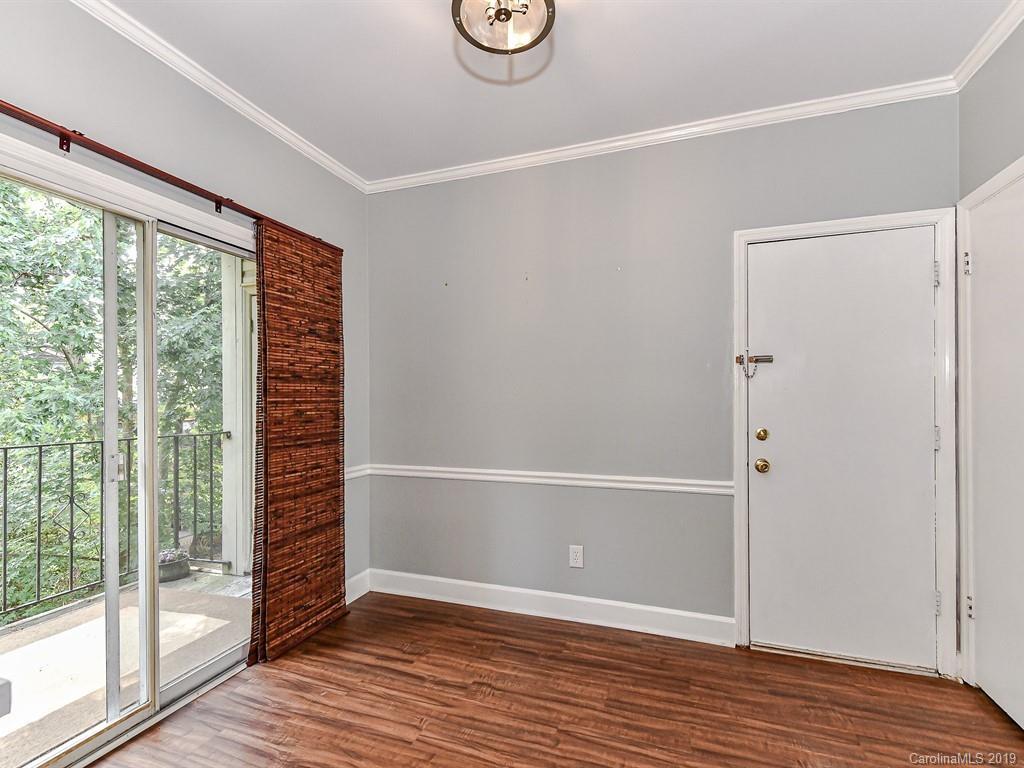 5925 Quail Hollow Road, Unit G Charlotte, NC 28210 - Photo 6 of 19 a view of room with window and wooden floor