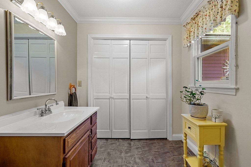 169 Wallace Hill Road Townsend, MA 01469 - Photo 12 of 42 a bathroom with a sink and a mirror