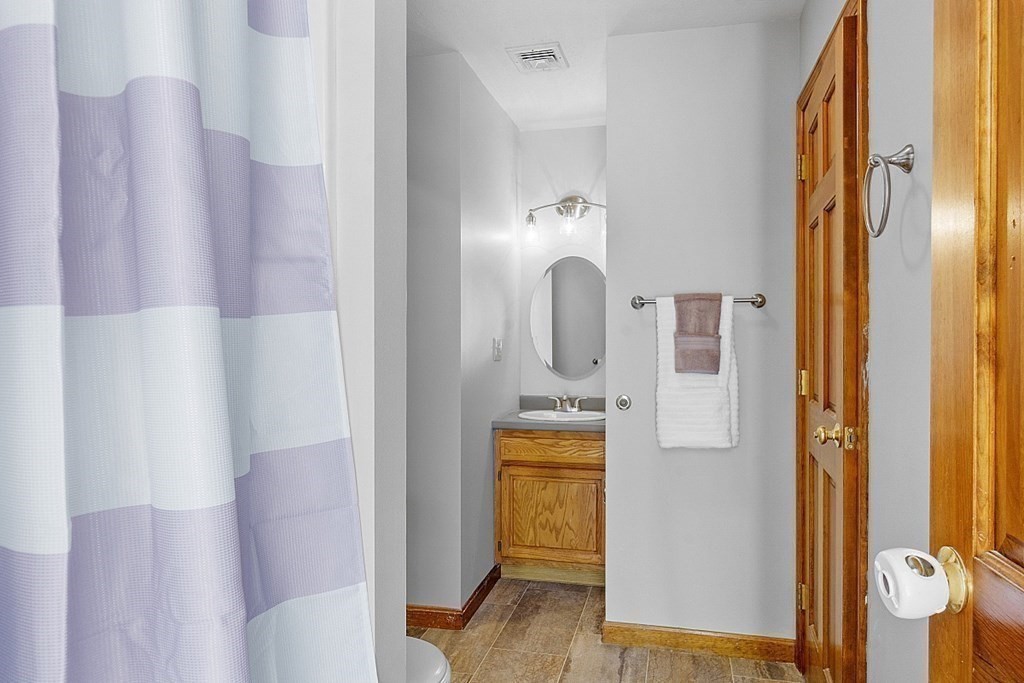 169 Wallace Hill Road Townsend, MA 01469 - Photo 24 of 42 a bathroom with a sink and mirror