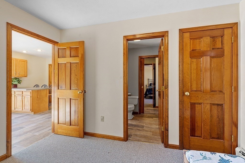 169 Wallace Hill Road Townsend, MA 01469 - Photo 29 of 42 a view of a hallway with wooden floor and closet area