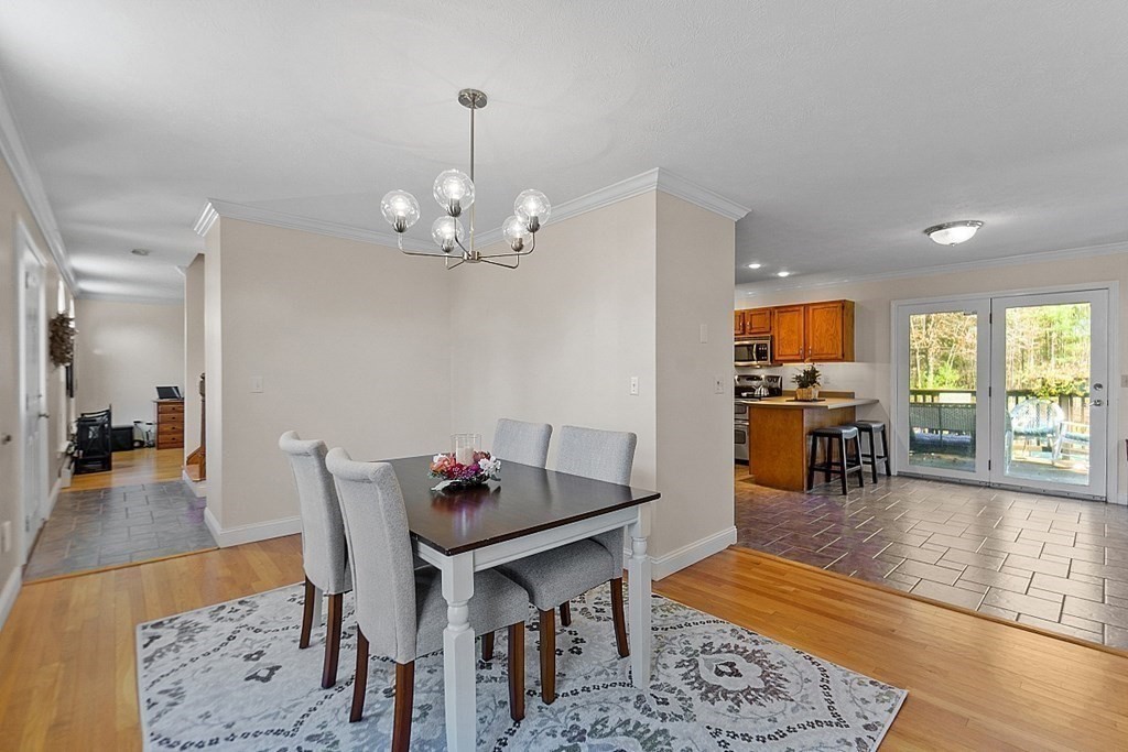 169 Wallace Hill Road Townsend, MA 01469 - Photo 3 of 42 a view of a dining room with furniture and wooden floor