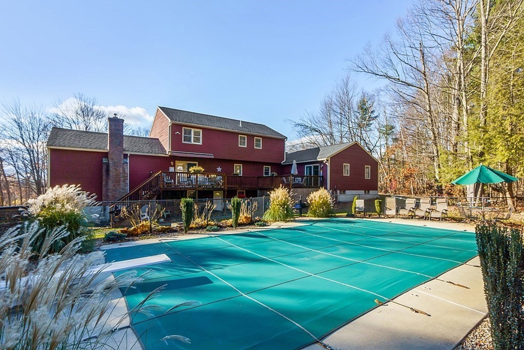 169 Wallace Hill Road Townsend, MA 01469 - Photo 41 of 42 a view of a building with a yard