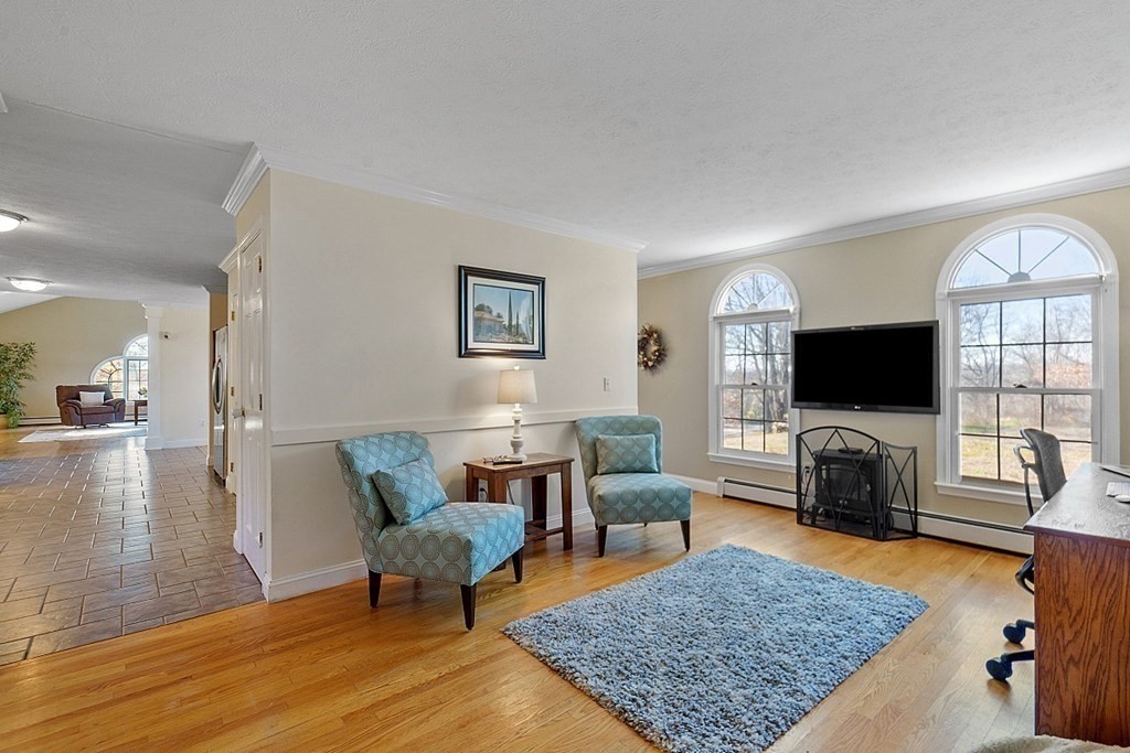 169 Wallace Hill Road Townsend, MA 01469 - Photo 5 of 42 a living room with furniture and a flat screen tv