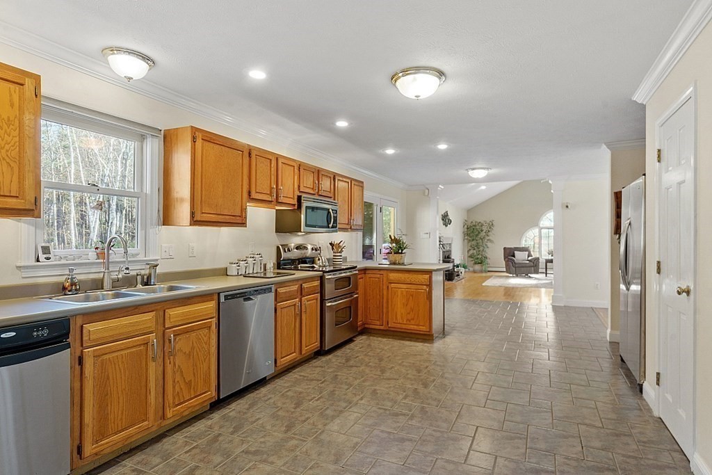 169 Wallace Hill Road Townsend, MA 01469 - Photo 6 of 42 a large kitchen with stainless steel appliances lots of counter top space