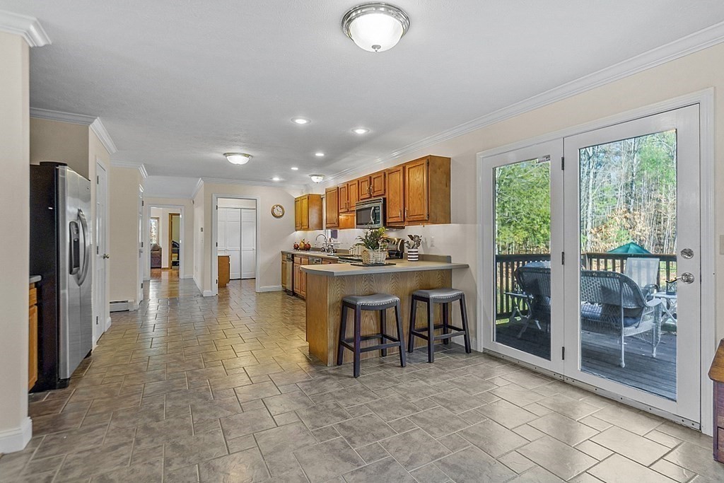169 Wallace Hill Road Townsend, MA 01469 - Photo 8 of 42 a view of a dining area with furniture window and outside view