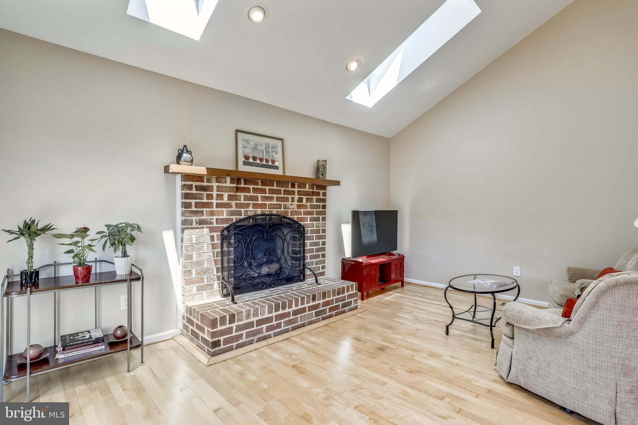 13924 Riding Loop Drive North Potomac, MD 20878 - Photo 14 of 45 Gas brick fireplace in Family Room with mantel