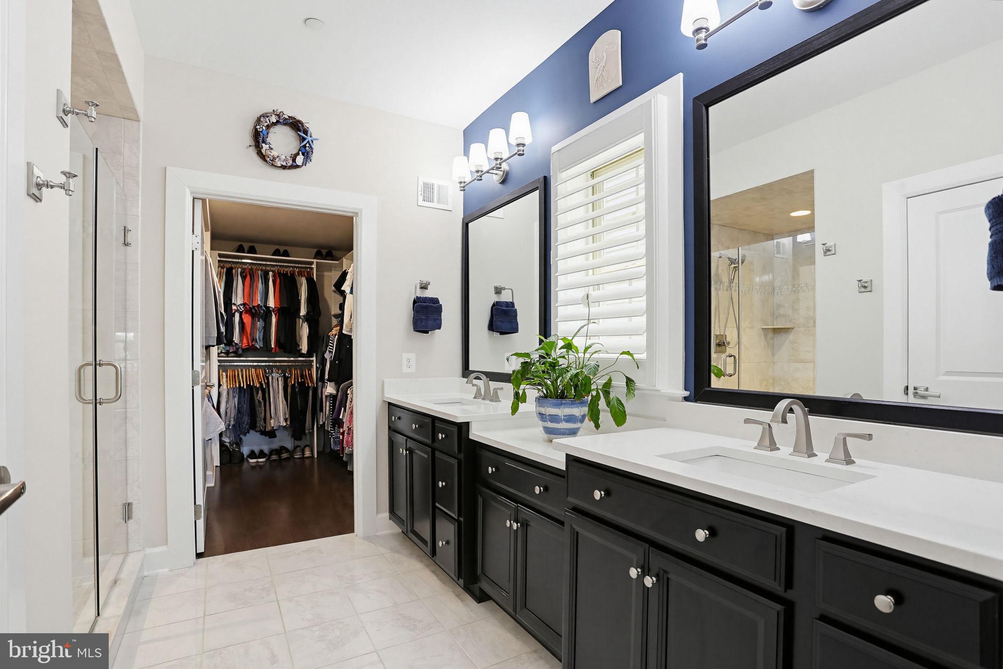 3816 Fulham Road Frederick, MD 21704 - Photo 20 of 77 a spacious bathroom with a double vanity sink and a mirror