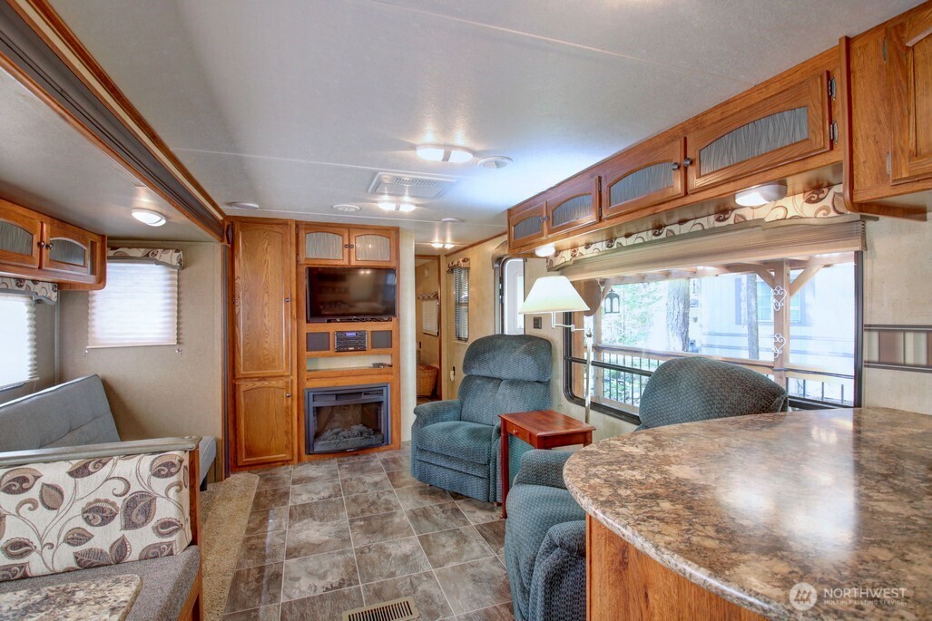 64 Wilderness Way Deming, WA 98244 - Photo 12 of 33 a living room with furniture and flat screen tv