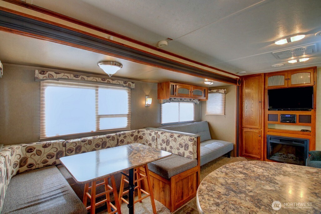 64 Wilderness Way Deming, WA 98244 - Photo 13 of 33 a living room with a bed and a television