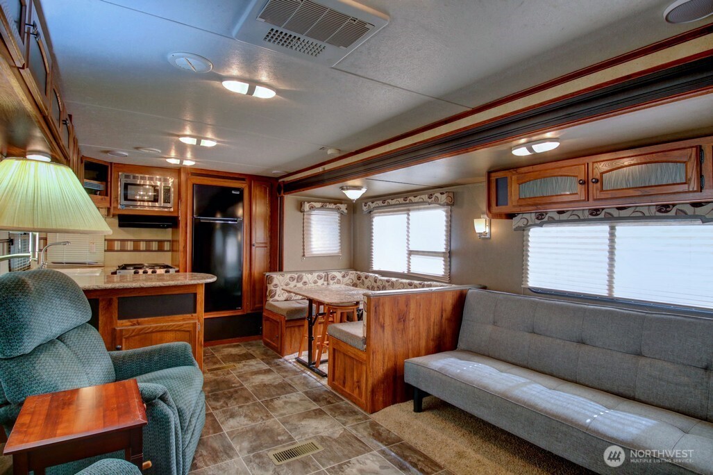 64 Wilderness Way Deming, WA 98244 - Photo 16 of 33 a living room with furniture and a flat screen tv