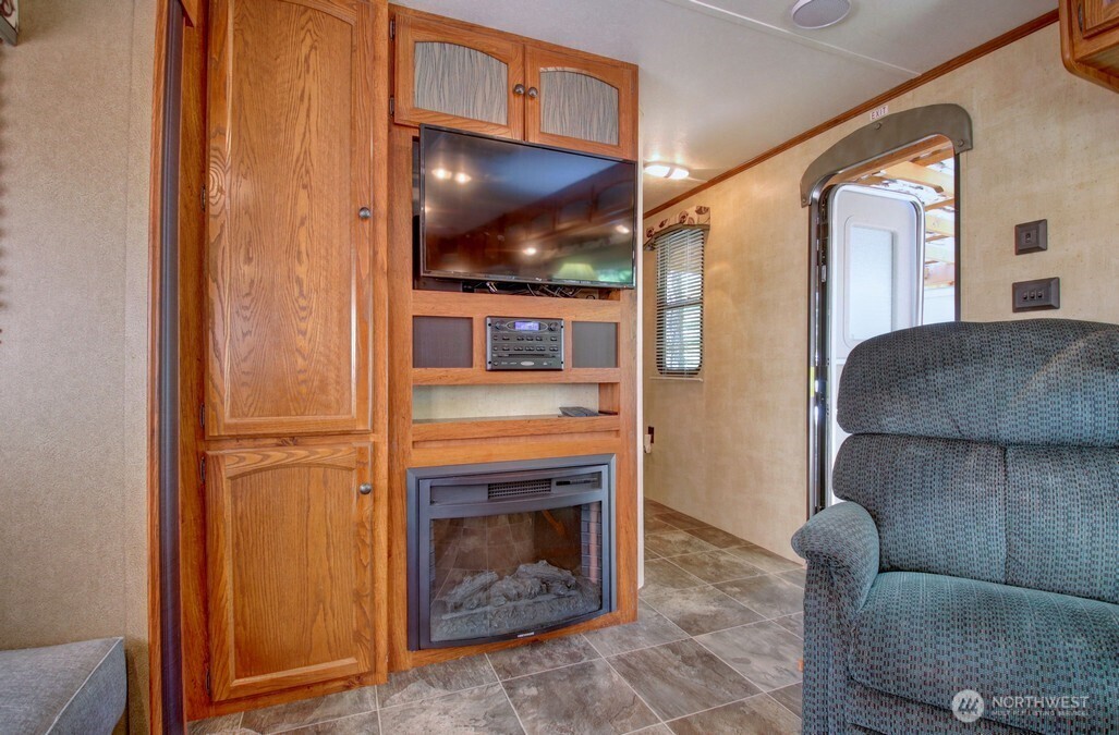 64 Wilderness Way Deming, WA 98244 - Photo 17 of 33 a living room with furniture and a fireplace