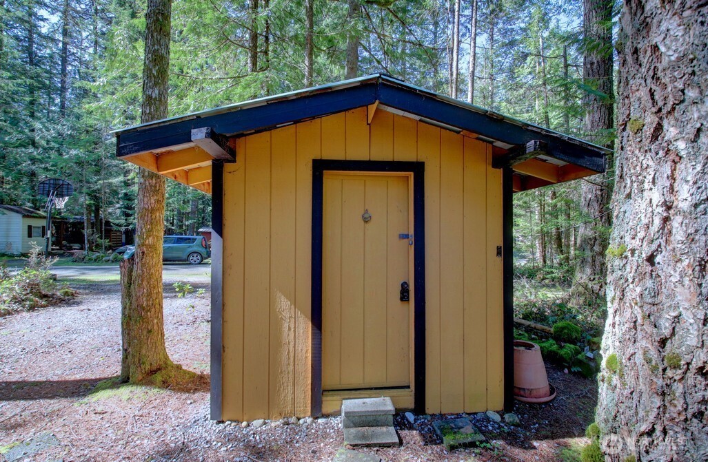 64 Wilderness Way Deming, WA 98244 - Photo 20 of 33 a view of a small house with backyard