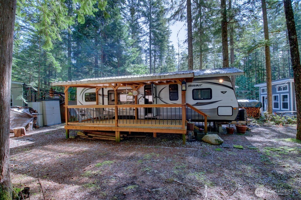 64 Wilderness Way Deming, WA 98244 - Photo 2 of 33 a view of a house with a yard and sitting area