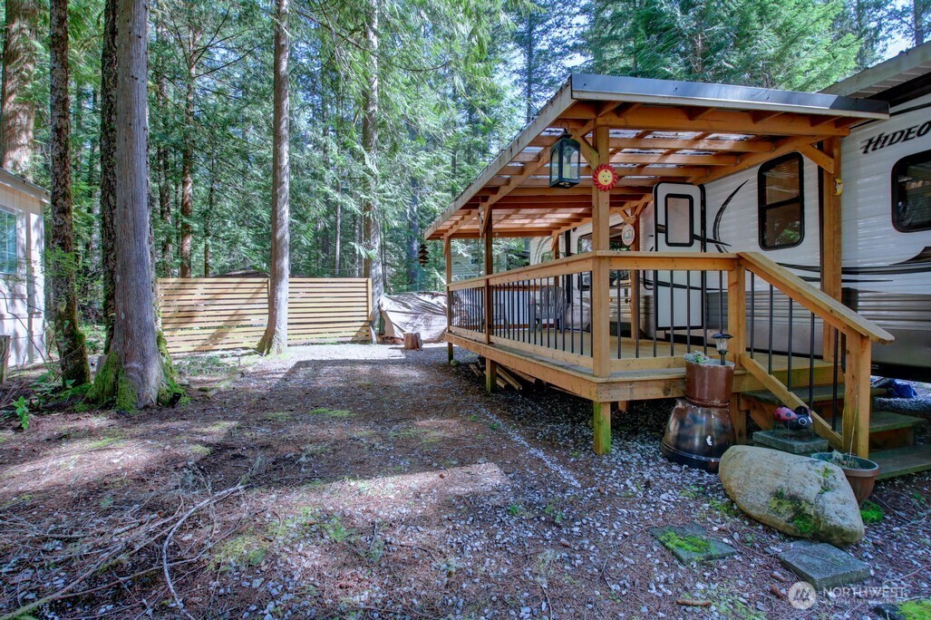 64 Wilderness Way Deming, WA 98244 - Photo 6 of 33 a view of a house with backyard and deck