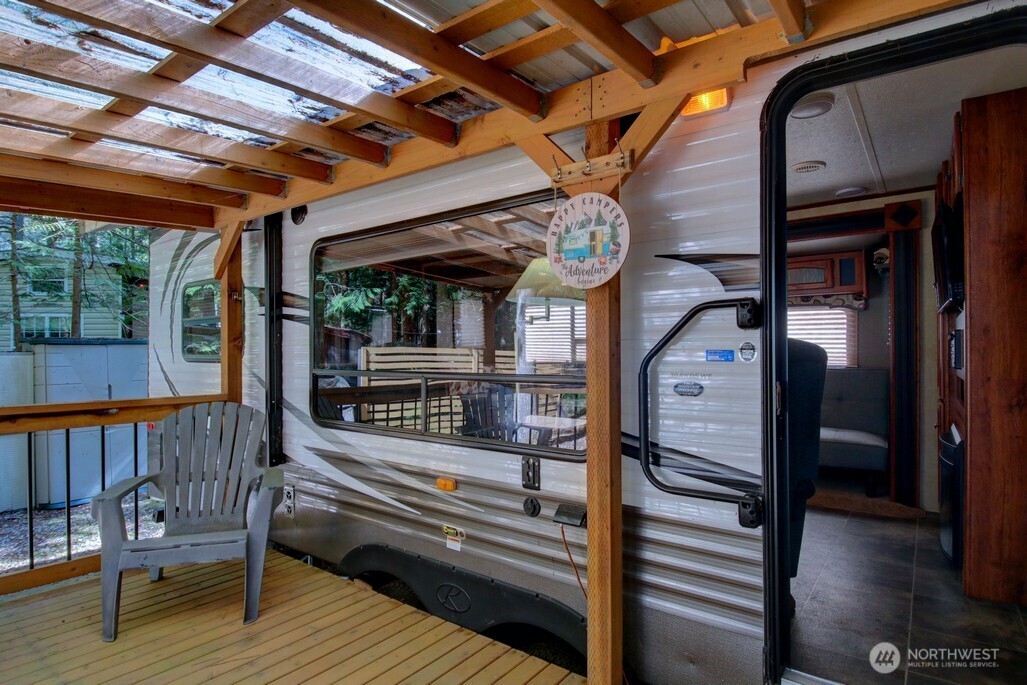 64 Wilderness Way Deming, WA 98244 - Photo 10 of 33 a view of a chairs and table in a balcony