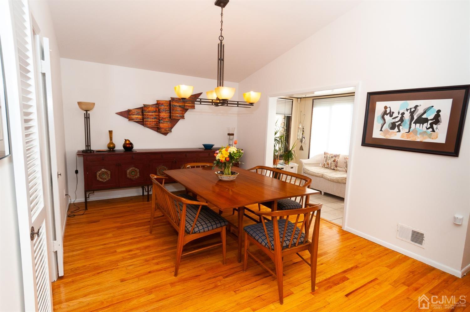 82 Harmon Road Edison, NJ 08837 - Photo 12 of 47 a view of a dining room with furniture and wooden floor