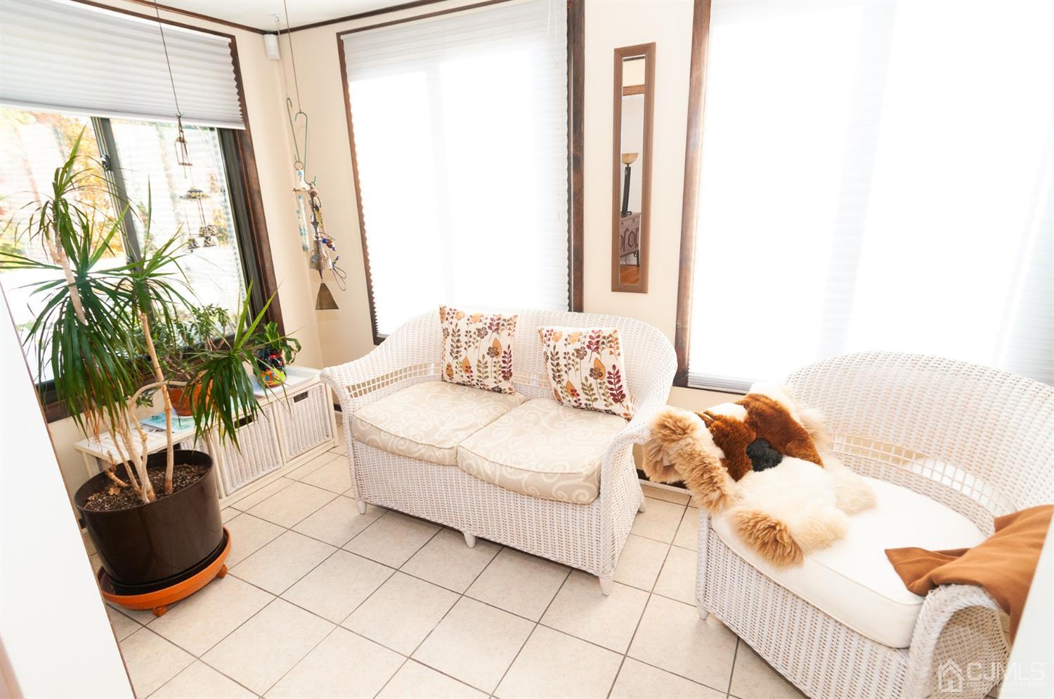 82 Harmon Road Edison, NJ 08837 - Photo 13 of 47 a bedroom with a bed and a potted plant