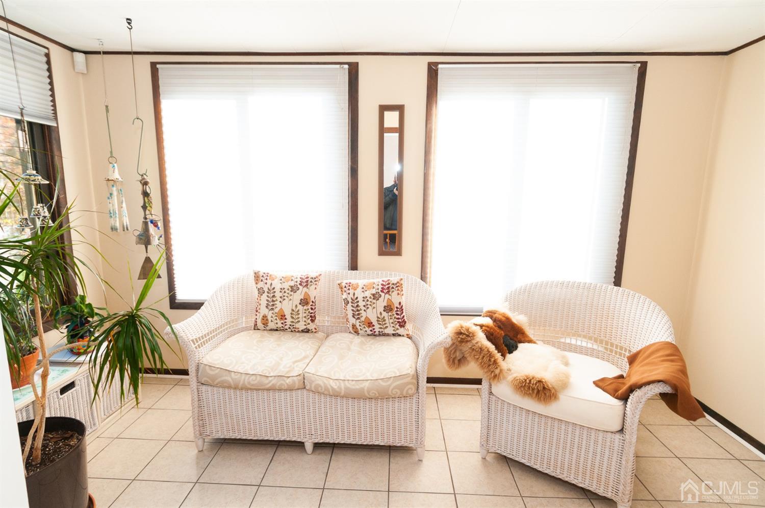 82 Harmon Road Edison, NJ 08837 - Photo 14 of 47 a living room with furniture and a rug