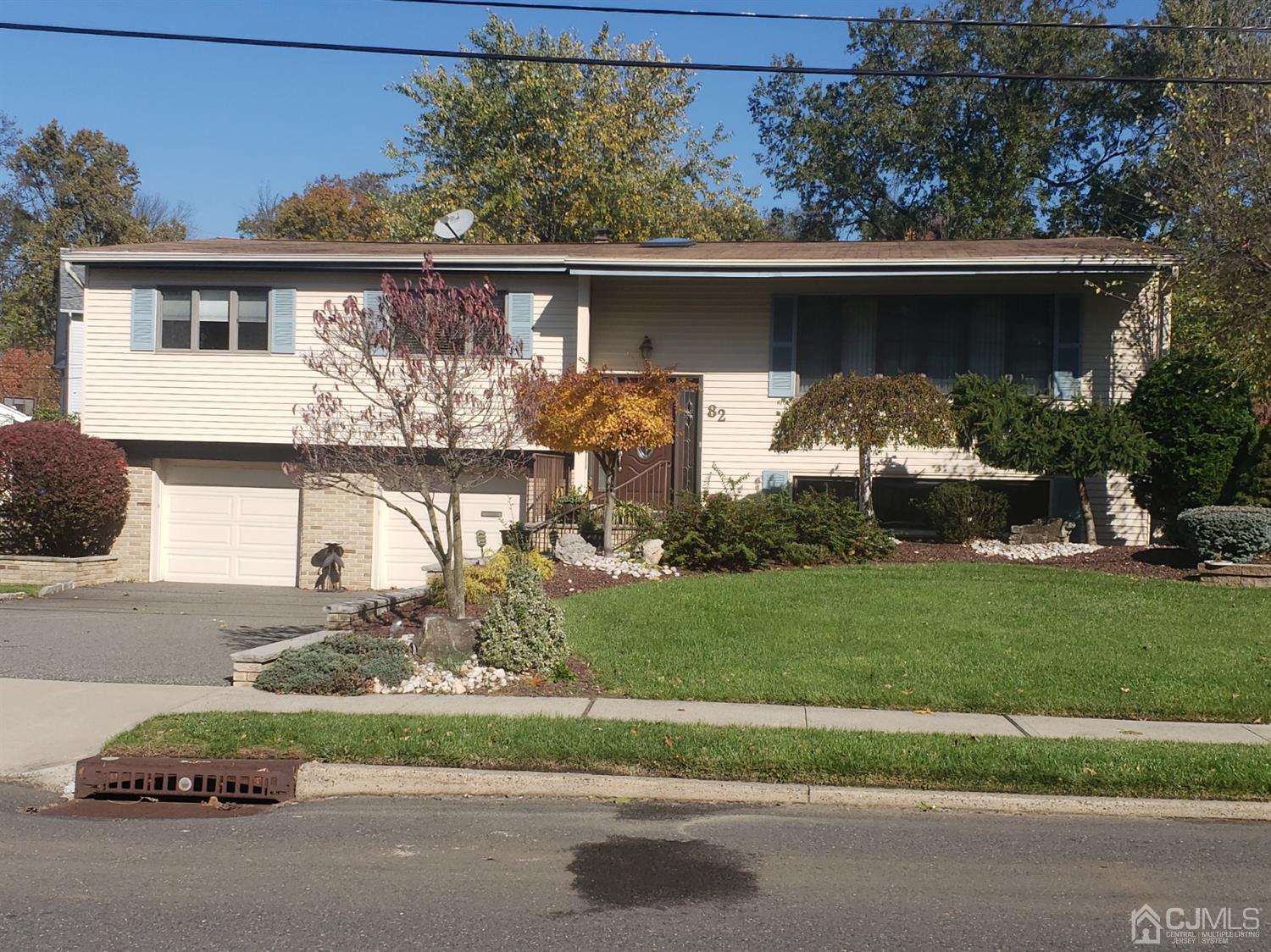 82 Harmon Road Edison, NJ 08837 - Photo 2 of 47 a front view of a house with garden