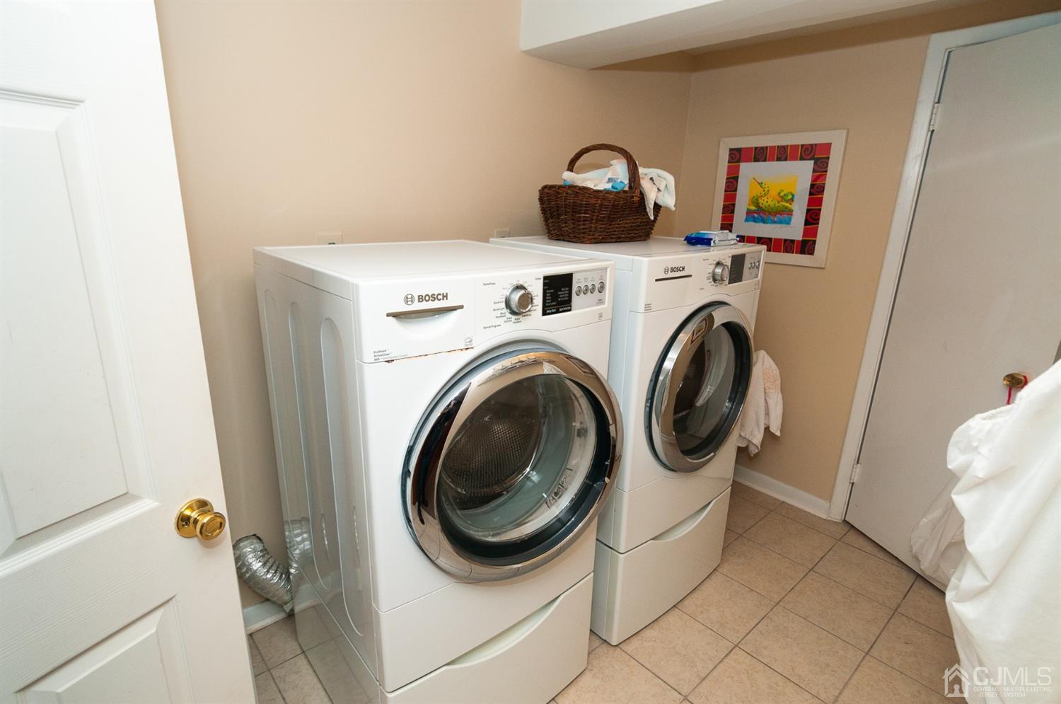 82 Harmon Road Edison, NJ 08837 - Photo 39 of 47 a utility room with dryer and washer
