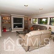 82 Harmon Road Edison, NJ 08837 - Photo 40 of 47 a bedroom with a bed and a flat screen tv