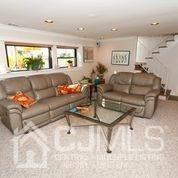 82 Harmon Road Edison, NJ 08837 - Photo 42 of 47 a living room with furniture and a large window