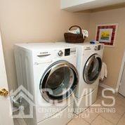 82 Harmon Road Edison, NJ 08837 - Photo 44 of 47 a view of livingroom with washer and dryer