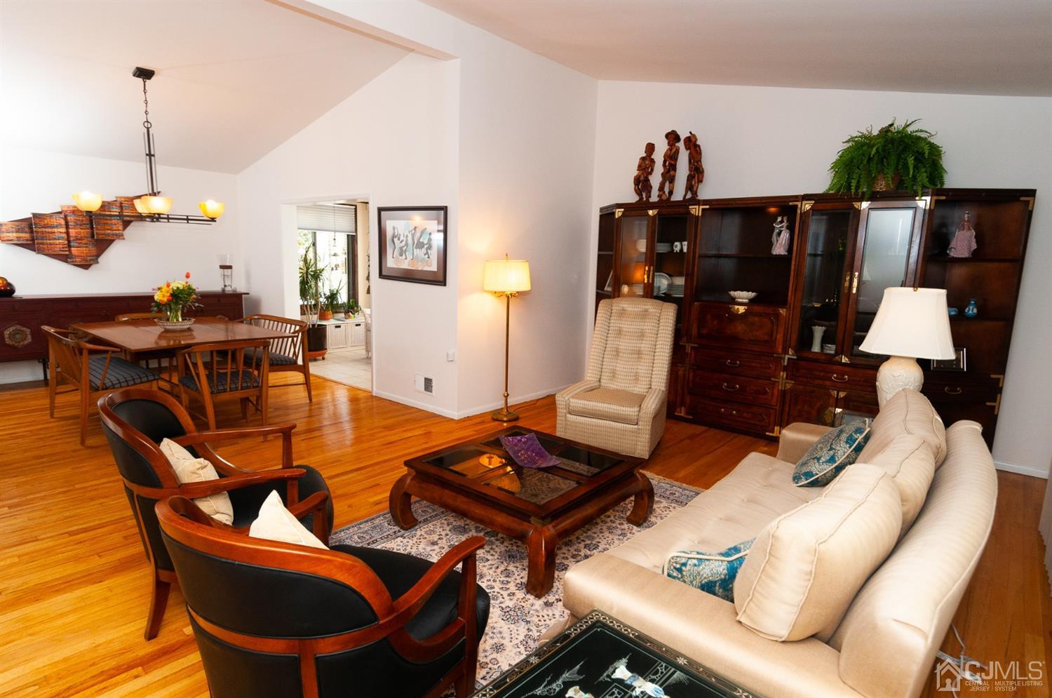 82 Harmon Road Edison, NJ 08837 - Photo 8 of 47 a living room with furniture a rug and white walls
