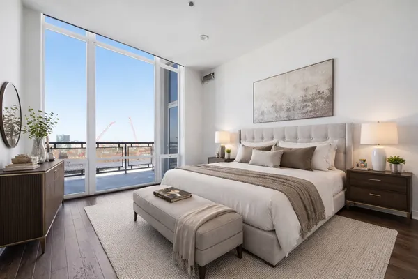 a bedroom with a bed and a couch