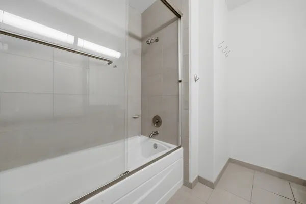 a bathroom with a tub and a shower